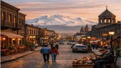 Gyumri city street with traditional black stone buildings and Mount Aragats in the background, Shirak region Armenia