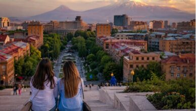 Travelers enjoying an evening view of Yerevan from the Cascade with Mount Ararat in the background