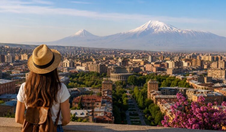 Traveler overlooking Yerevan city center with Mount Ararat and panoramic Armenia landscape in the background