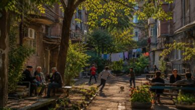 Traditional residential courtyard in Yerevan with children playing and neighbors socializing