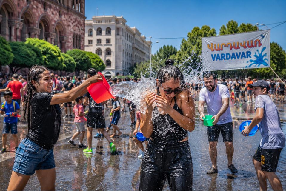 Locals and tourists celebrating Vardavar with water in central Yerevan